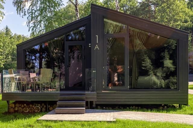 Dark steel modular cabin with glazing